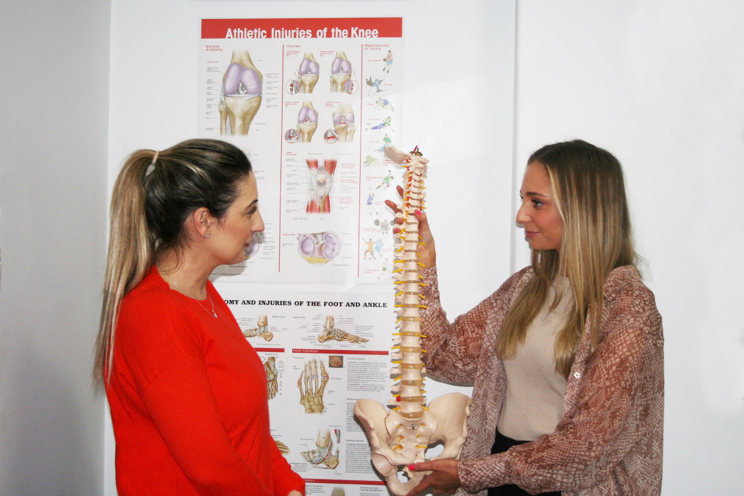 Uprise Health chiropractor performing a gentle lower back adjustment